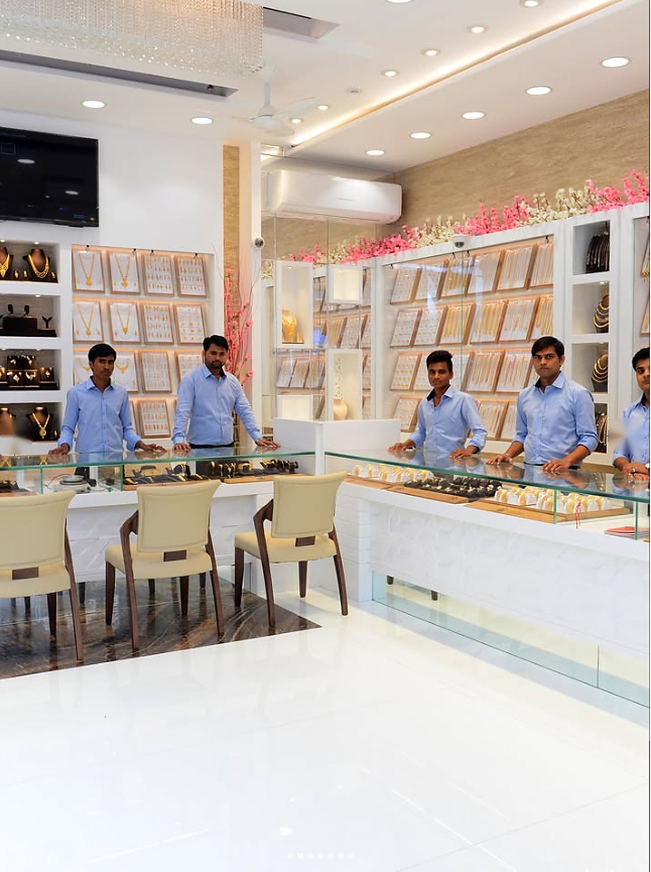 Ambika Jewellers staff standing behind the display counters